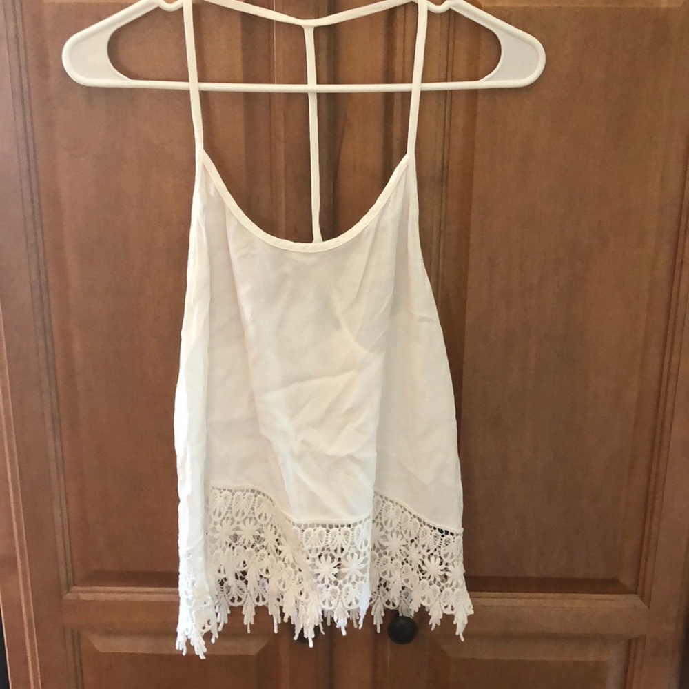 Beach open back white top